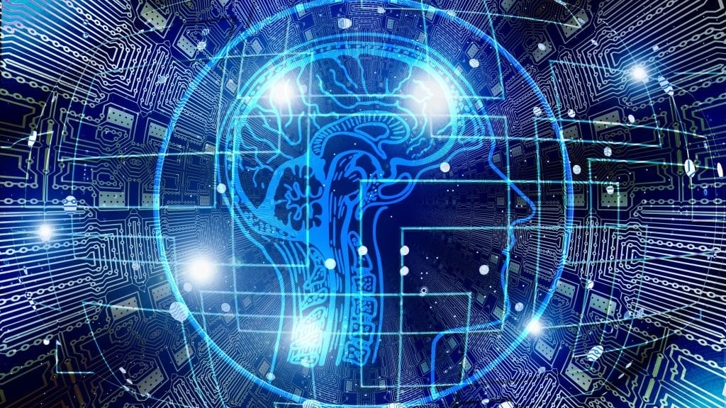 A digital illustration of a glowing blue brain and circuit patterns within a human head silhouette, symbolizing artificial intelligence and technology integration.
