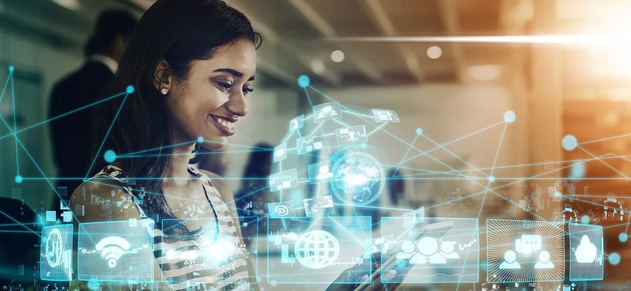 Woman using a tablet with digital icons and a network overlay, illustrating connectivity and technology.