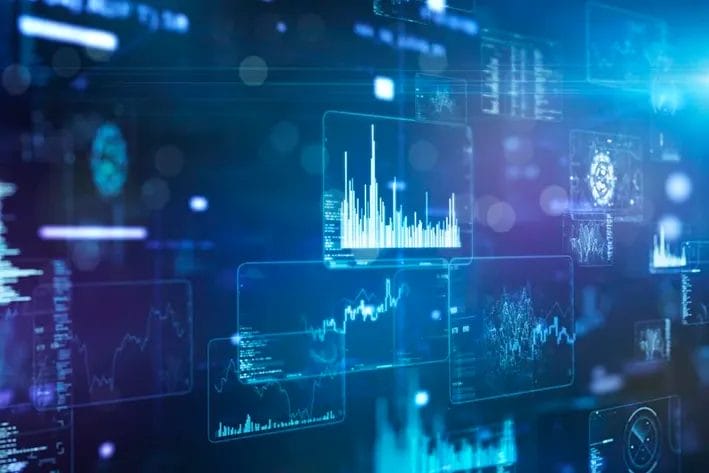 Multiple digital screens display various data visualizations and graphs against a dark, blue-toned background, suggesting data analysis or financial technology.
